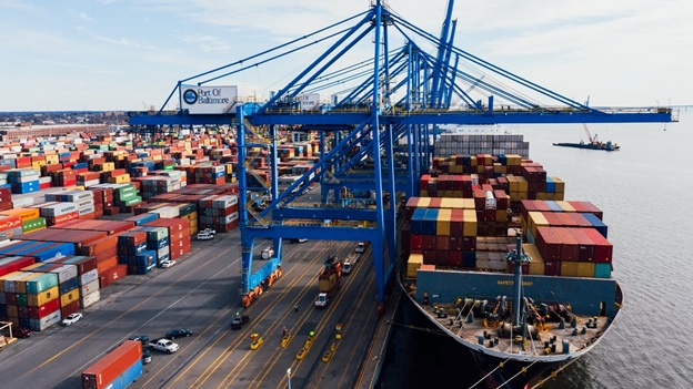 Containers being loaded onto a cargo ship