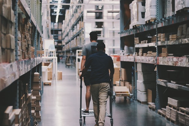 Workers walking through a warehouse