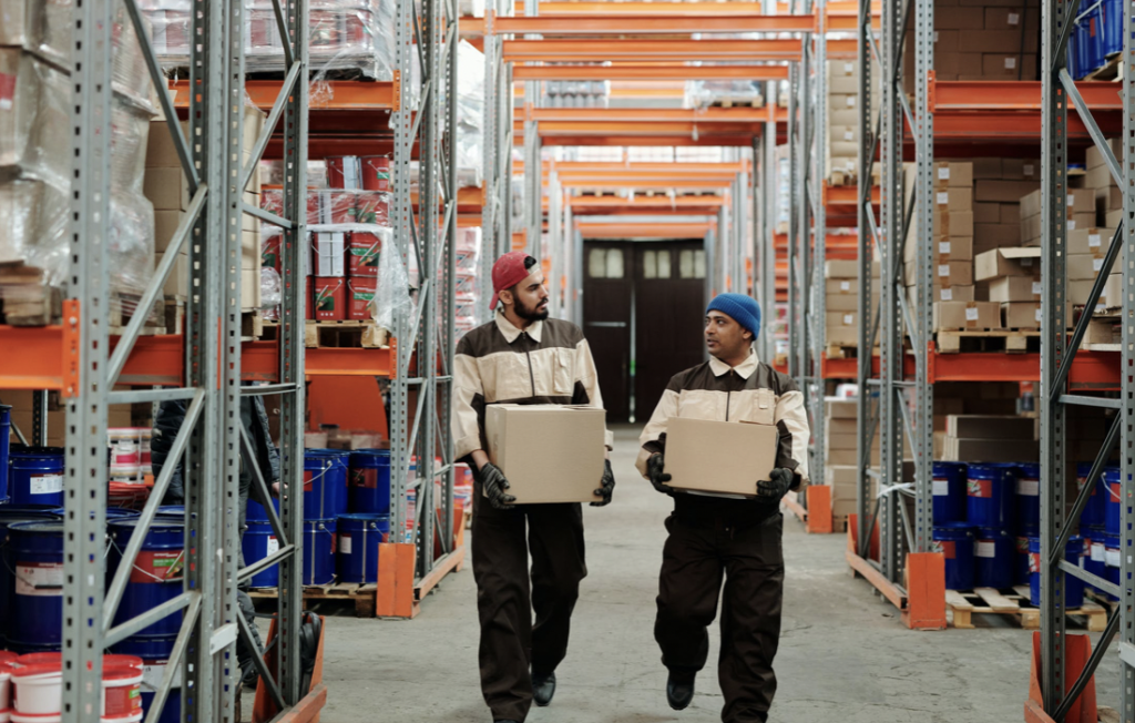 Workers carrying products for delivery