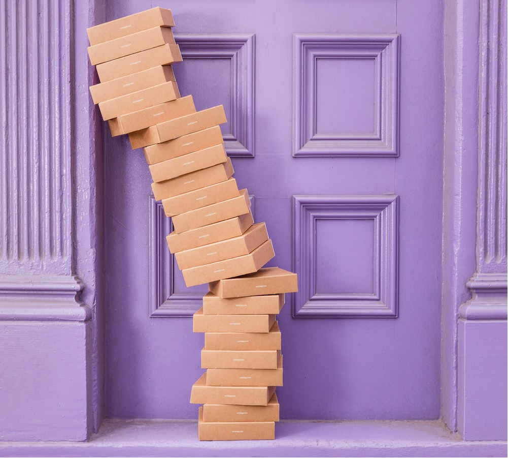 A stack of packages against a doorframe