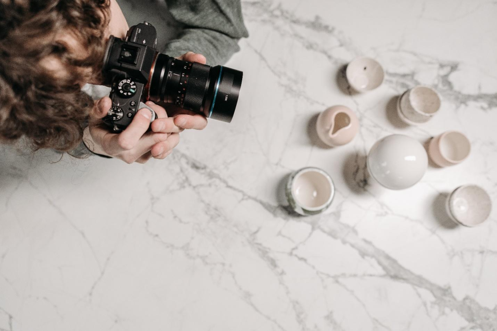 a person taking pictures of a product with a professional camera