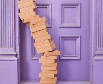 A stack of packages against a doorframe