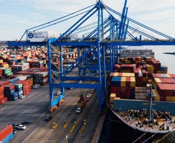 Containers being loaded onto a cargo ship