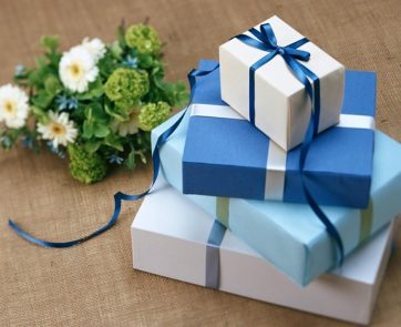 Several Gift Boxes Near the White Flowers